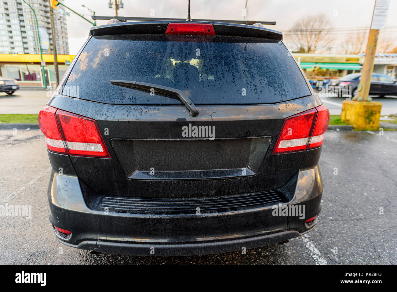 rear view of the car parked in the city, in the afternoon, in the ...