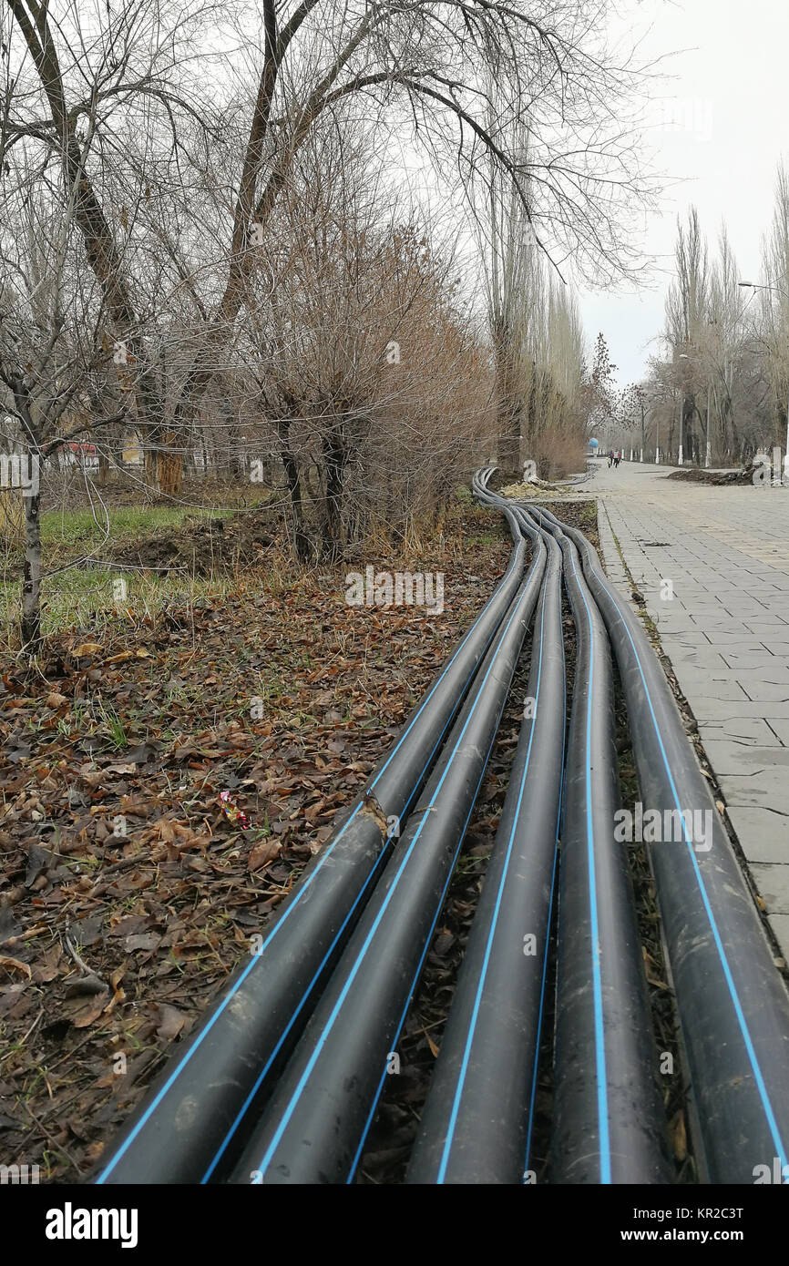 Laying of the sprinkler system of the pipeline in the ground trenches for the underground