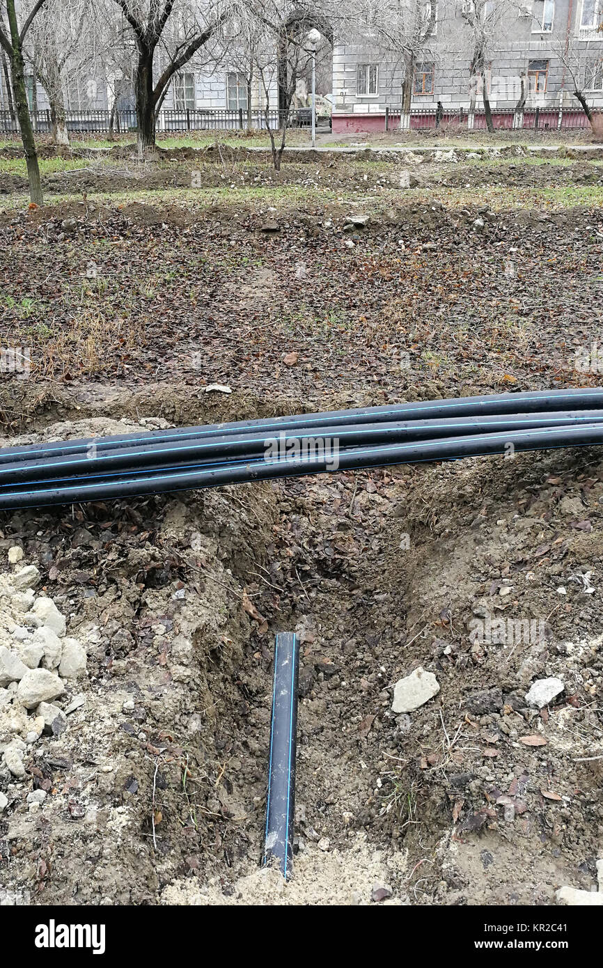 Laying of the sprinkler system of the pipeline in the ground trenches for the underground