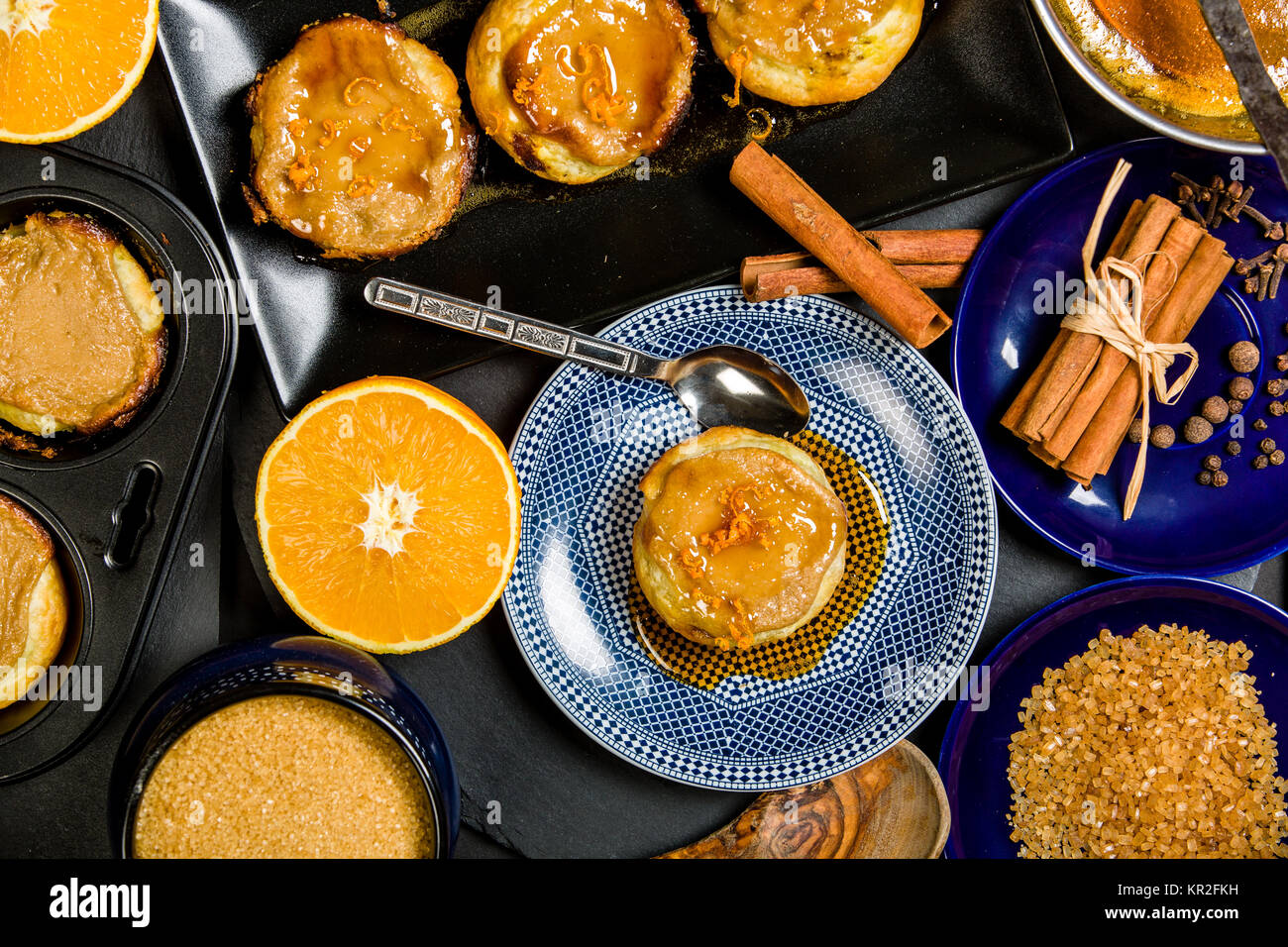 Typical homemade Portuguese Custard Tarts with orange caramel Stock
