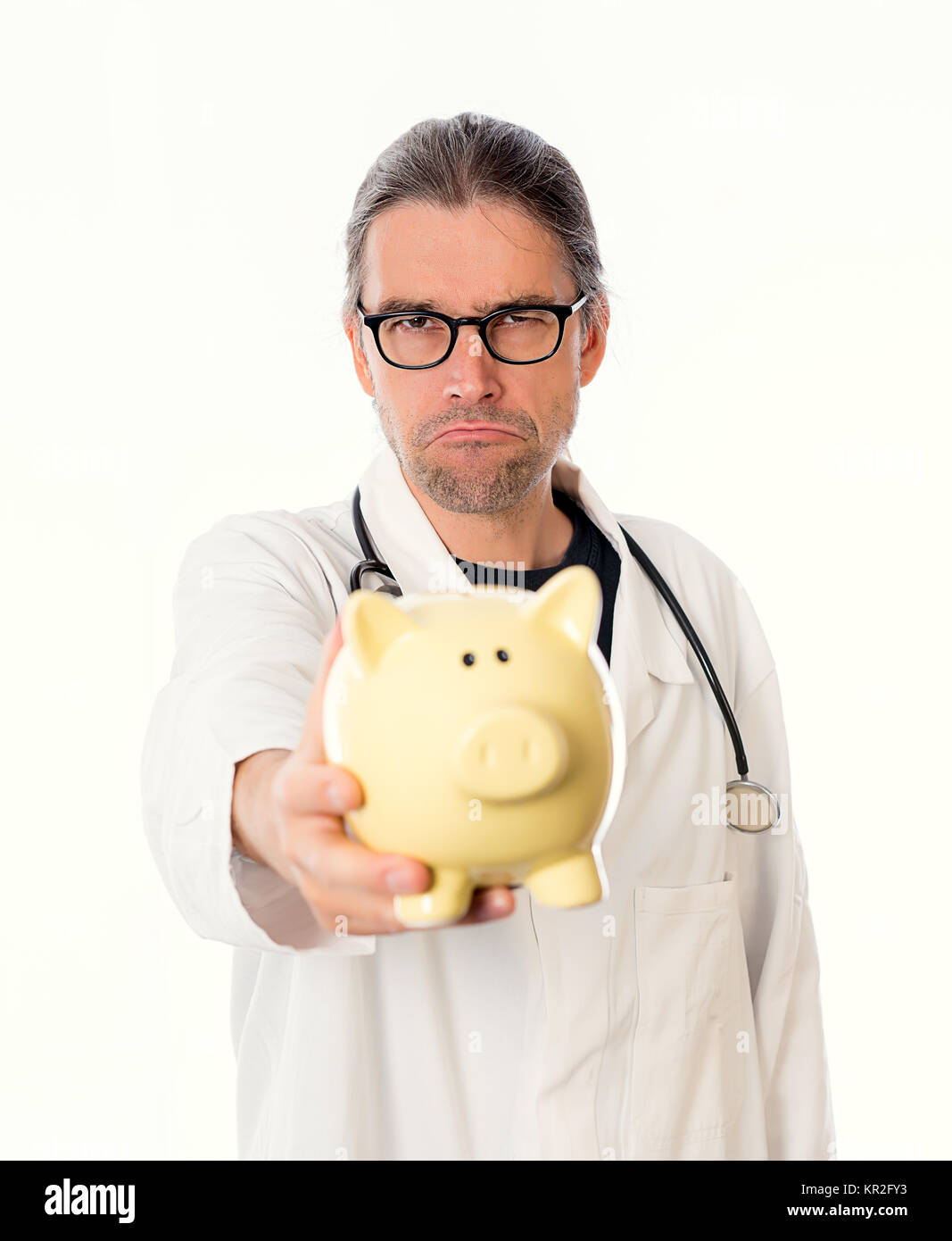 angry doctor with piggy bank in white lab coat Stock Photo - Alamy