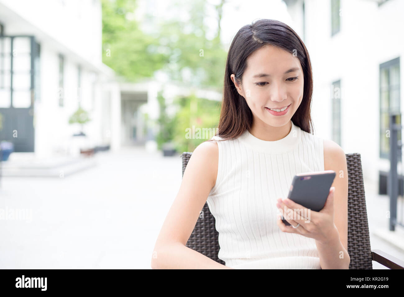 Asian woman use of mobile phone Stock Photo - Alamy