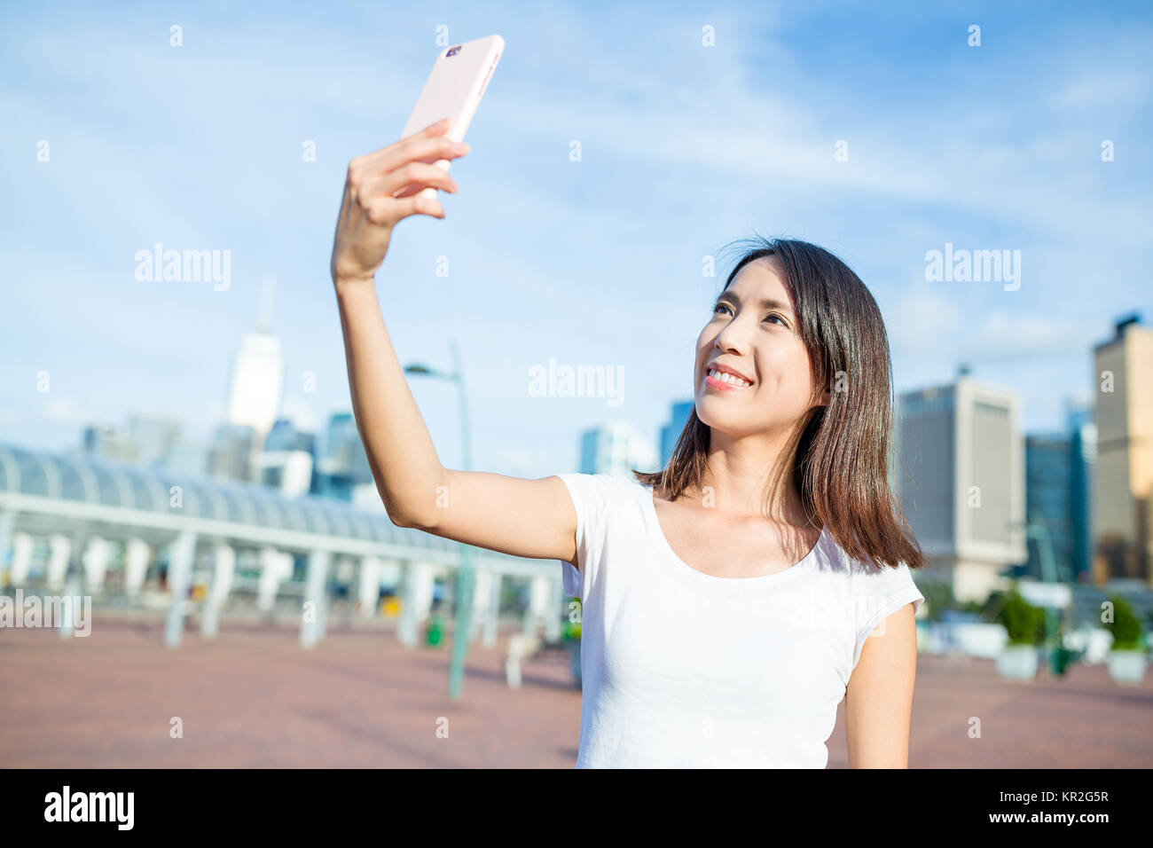 Woman taking selfie by mobile phone Stock Photo - Alamy