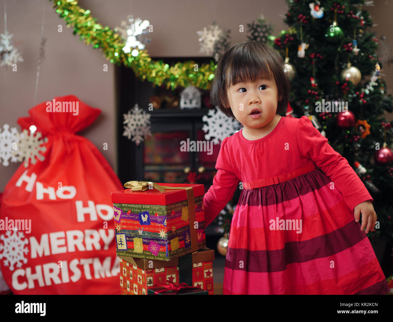 happy girl celebrating Christmas at home Stock Photo - Alamy