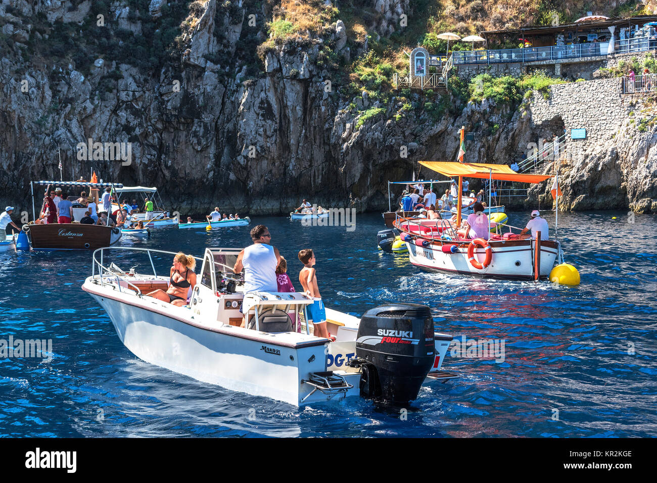 tourists waiting to enter the blue grotto on the island of capri, italy. Stock Photo