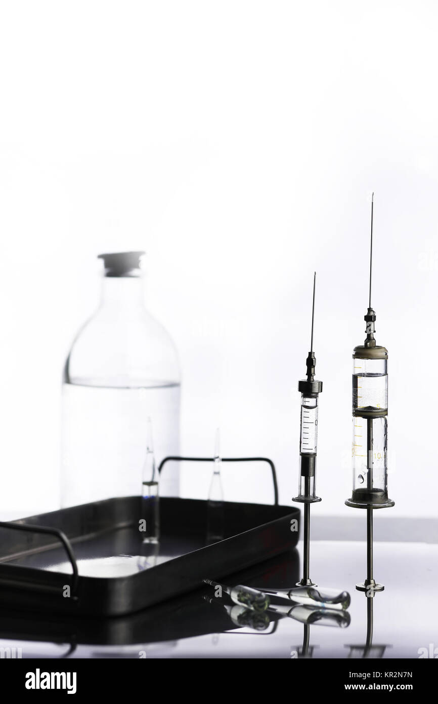 Old metal medical syringe and accessories on the table Stock Photo Alamy
