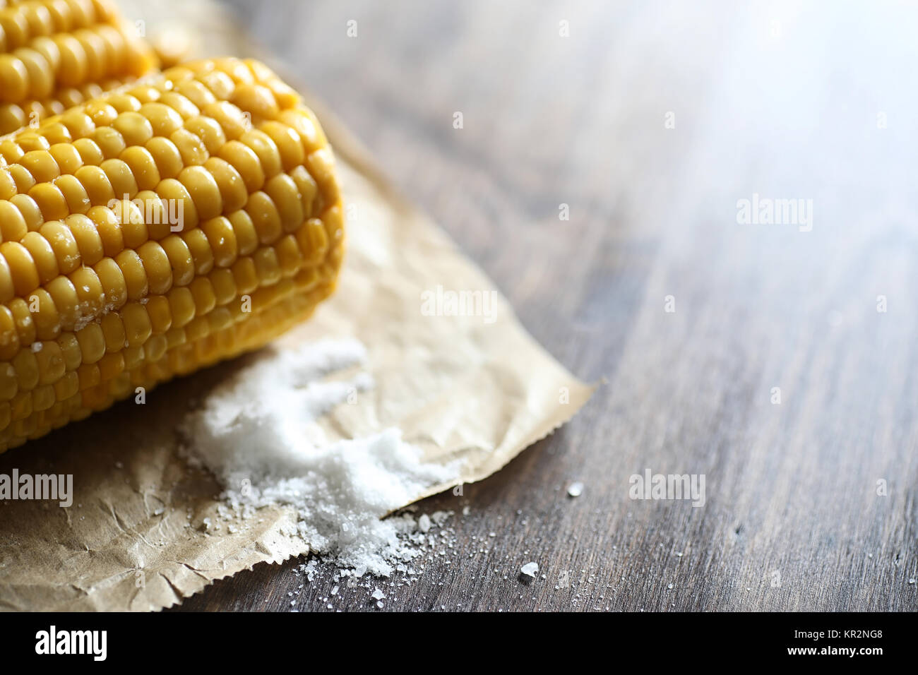 Boiled corn cob with salt on a wood Stock Photo Alamy