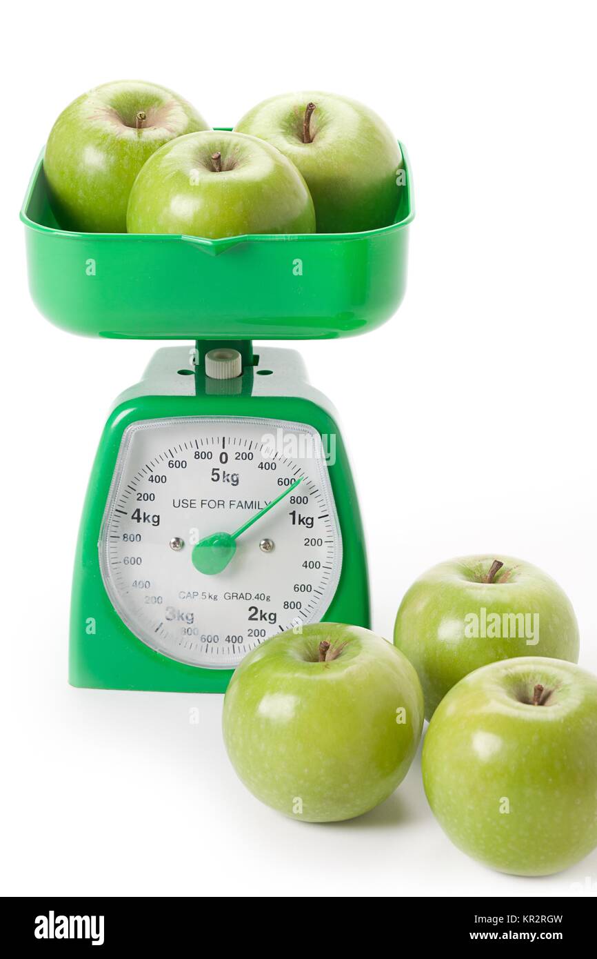 sets of green apples weighed Stock Photo - Alamy