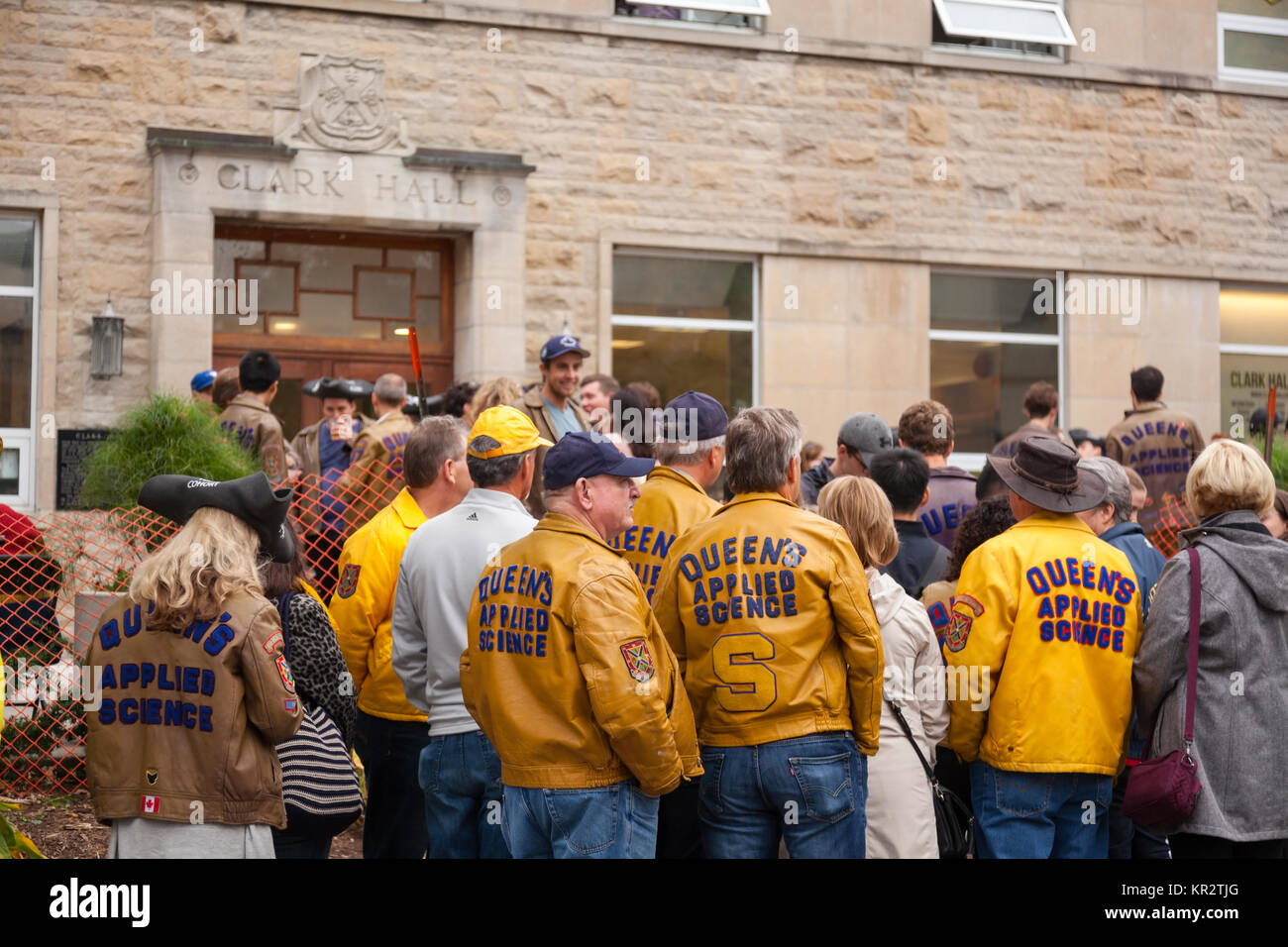 Queen's Applied Science students and faculty wearing jackets outside Clark Hall Pub at Clark Hall at Queen's University at Kingston in Kingston, ON CA Stock Photo