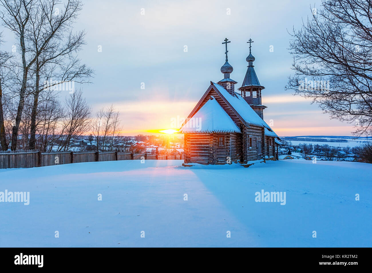 Russian church in winter forest Stock Photo