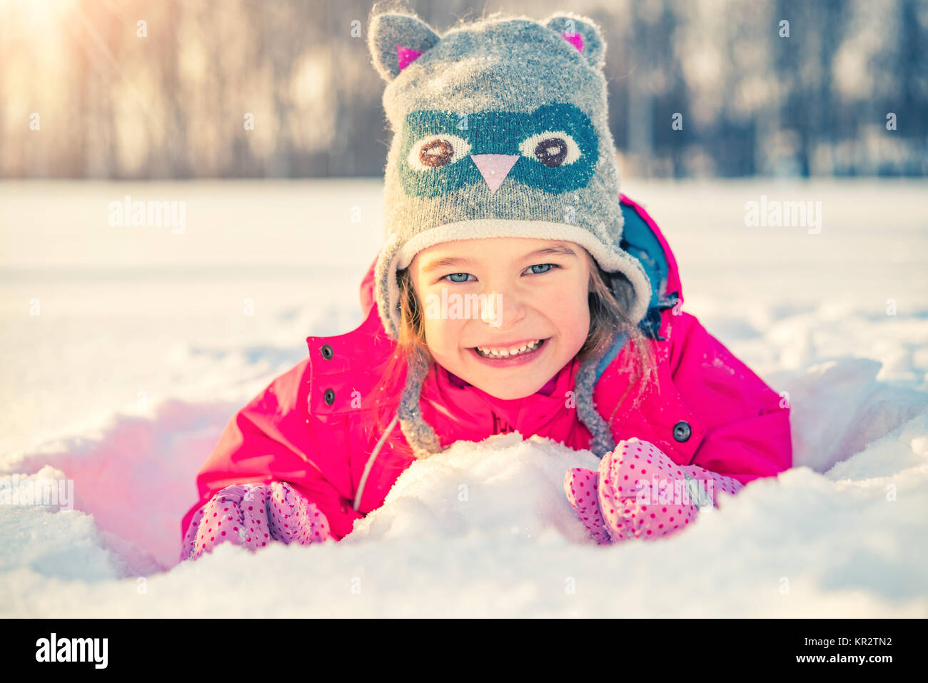 Little girl in a winter park Stock Photo