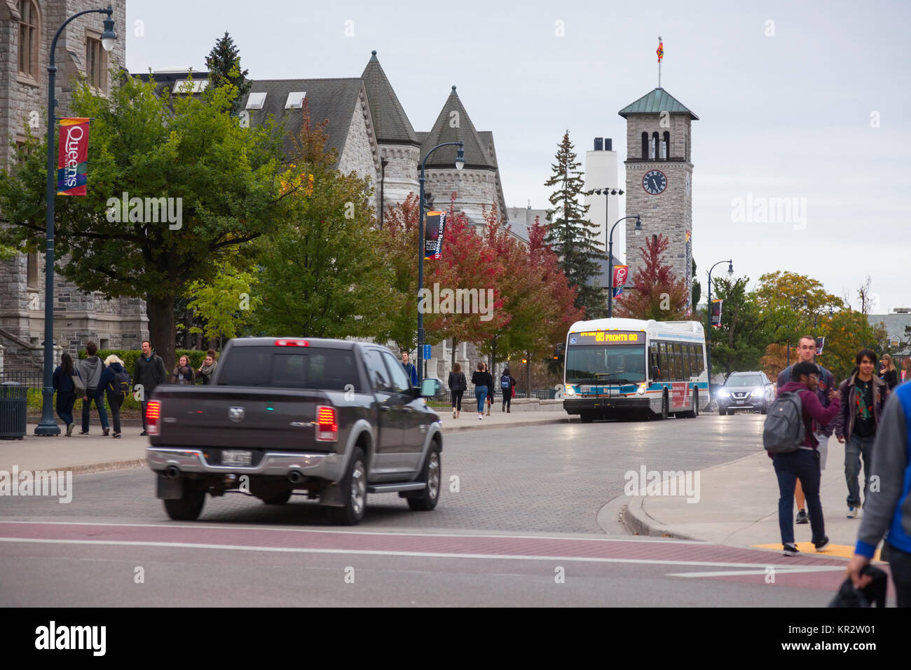 Many students walking down University Avenue at Queen's University at Kingston in Kingston, Ontario, Canada. Stock Photo