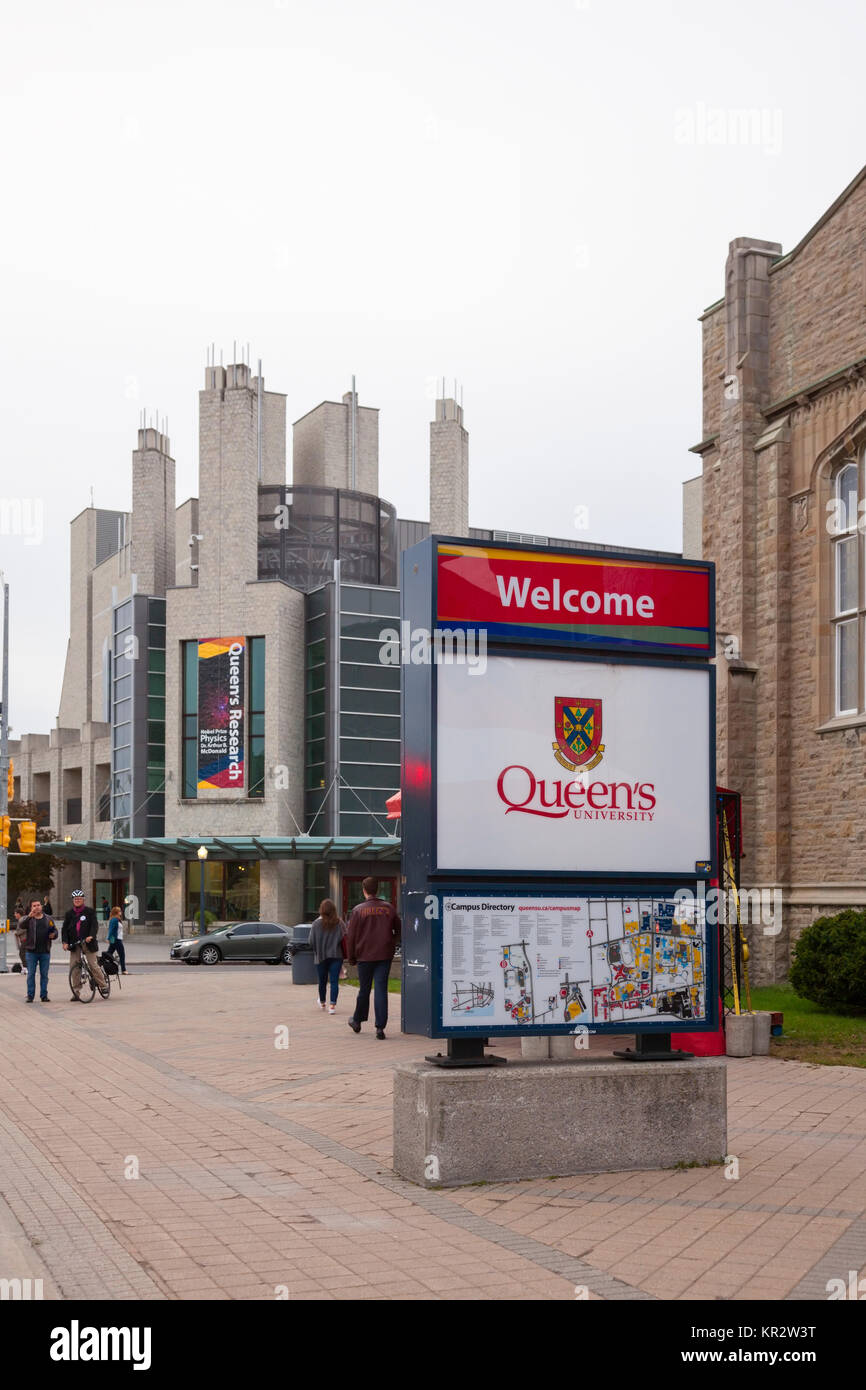 A Queen's University sign and the Joseph S Stauffer Library at Queen's University at Kingston in Kingston, Ontario, Canada. Stock Photo