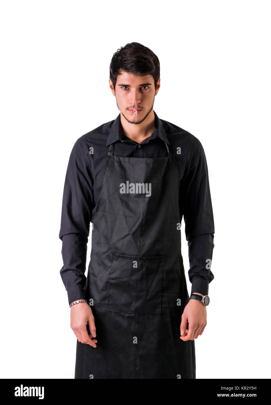 Young chef or waiter wearing black apron isolated Stock Photo - Alamy