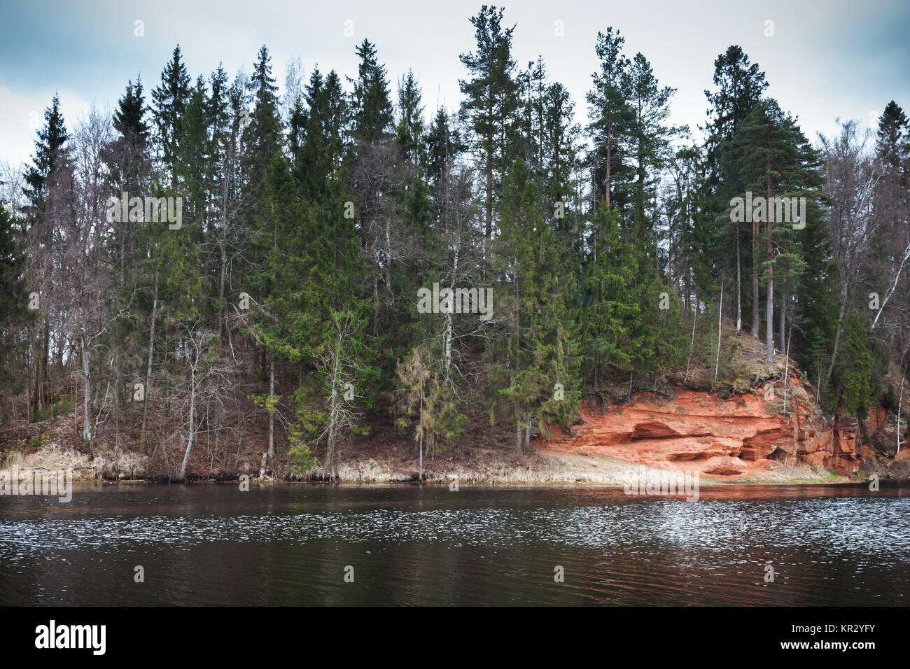 Red sandy coast of Oredezh River, spring landscape.  Leningrad Oblast, Russia Stock Photo