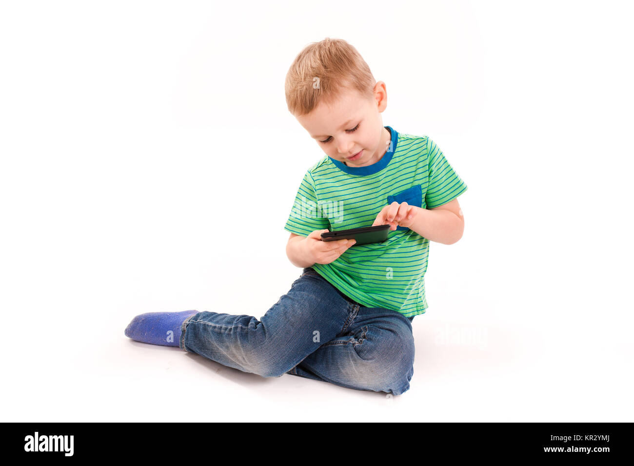 Curious little boy using tablet pc isolated on white Stock Photo - Alamy