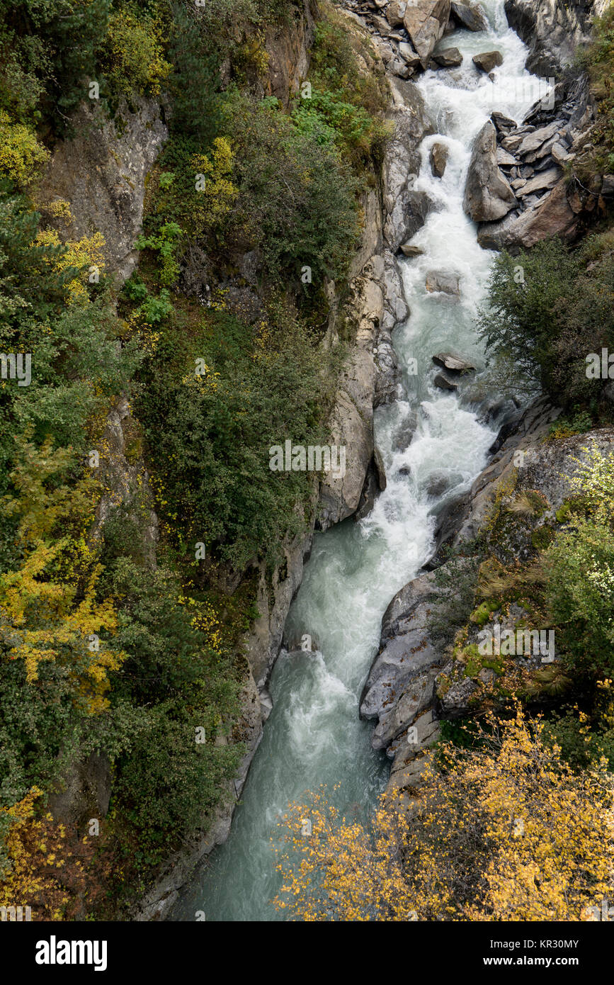 The Alps Rivers Mountain river and trees landscape natural environment. Hiking in the ...