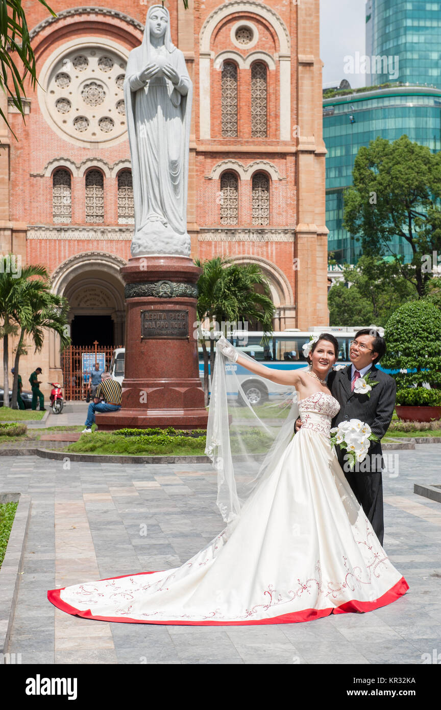 Wedding Couple Posing Outside Notre Dame Cathedral In Saigon The