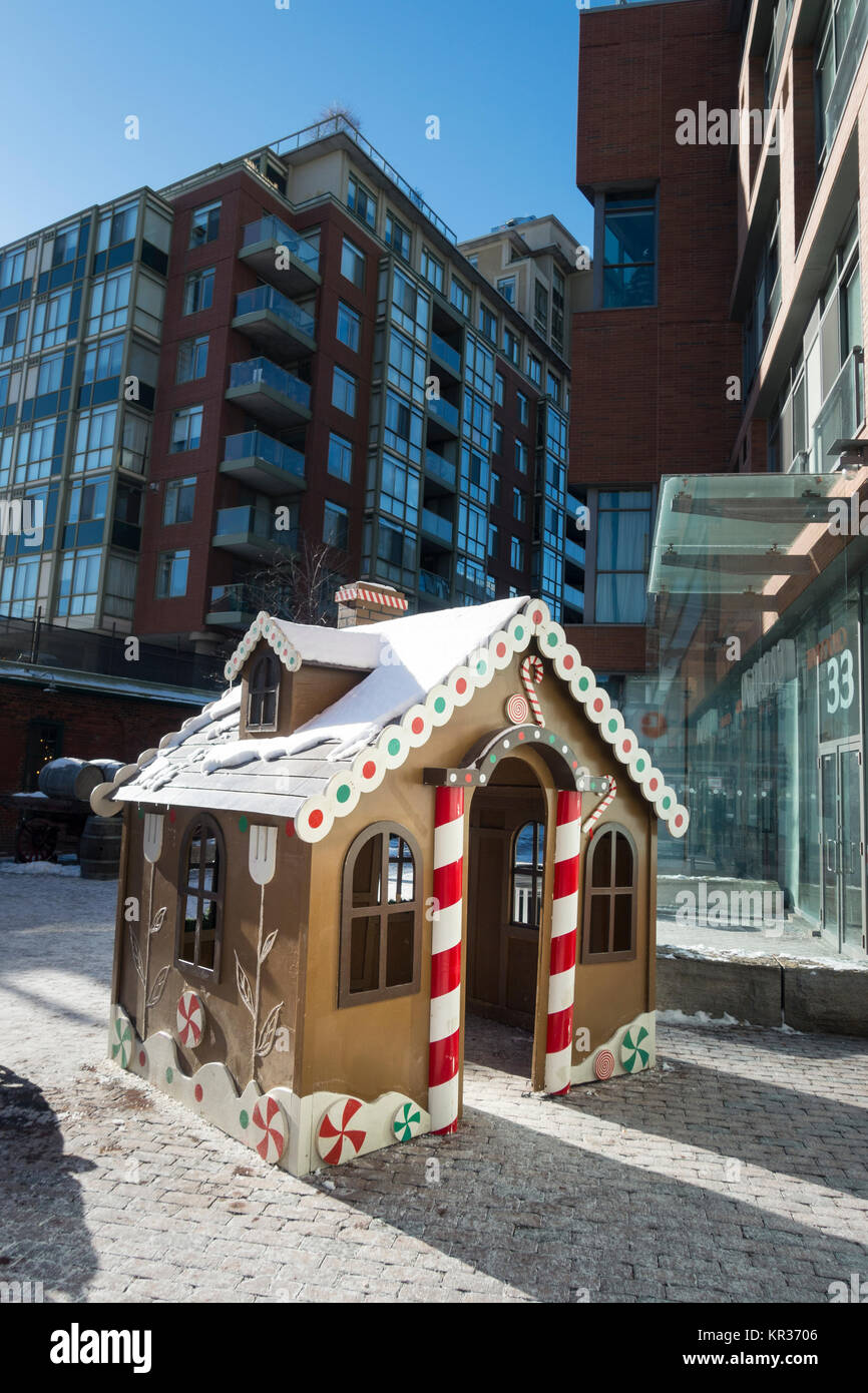 A small warming hut in the style of a gingerbread house set up for children during the Christmas season in Toronto's historic distillery district Stock Photo