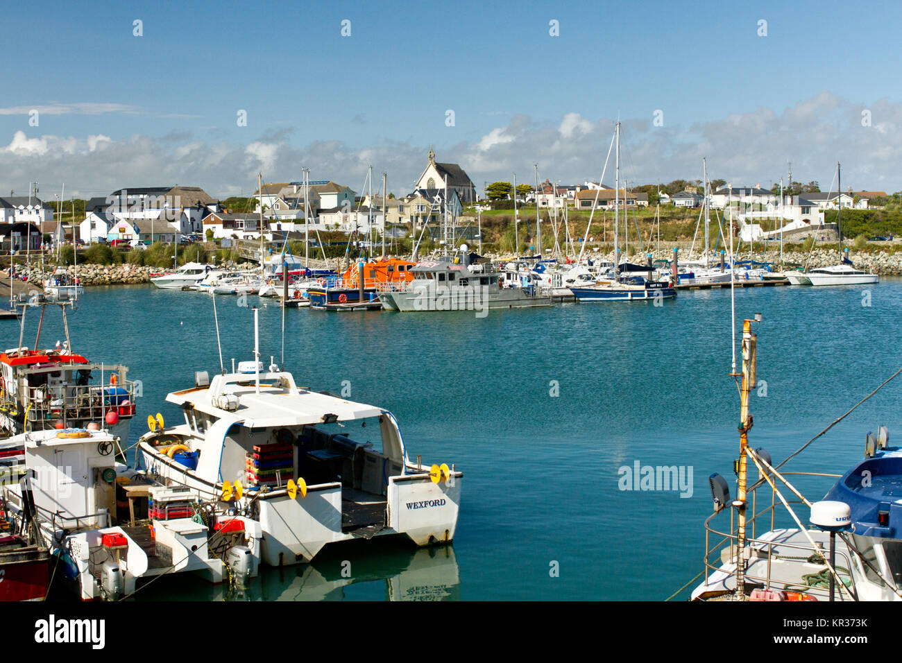 Beautiful little port town in Wexford, Ireland with a view on the local fishermen boats and yachts Stock Photo