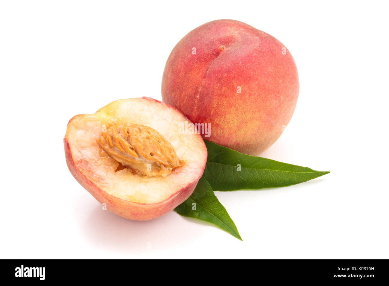 Ripe peaches with leaves. Stock Photo