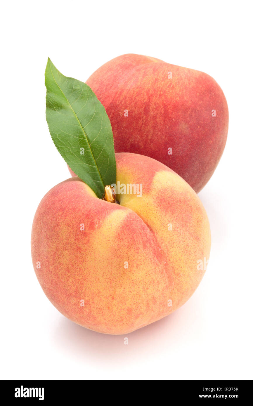Ripe peaches with leaves. Stock Photo