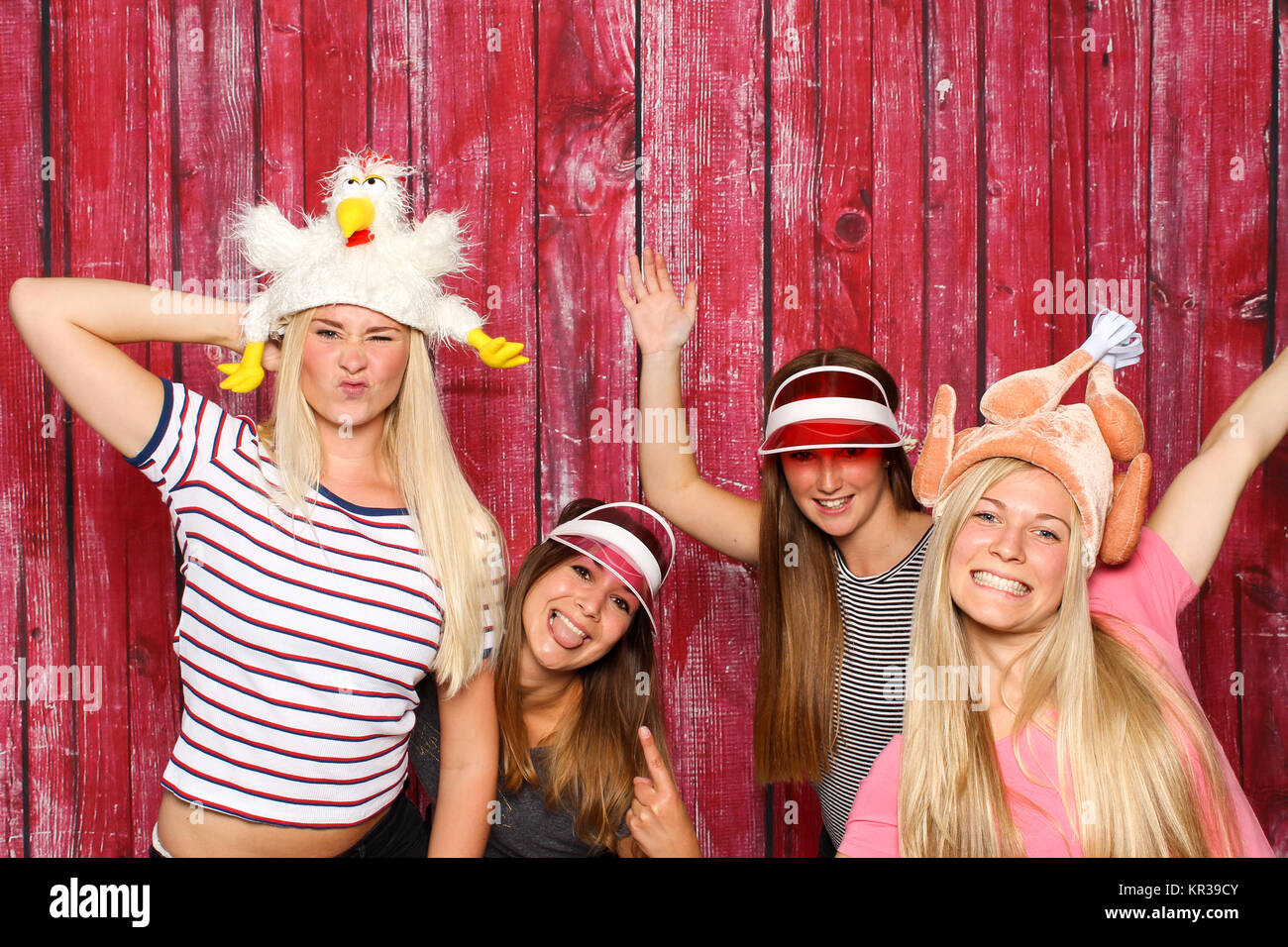 crazy chickens at a party - 4 girl with a photo box Stock Photo