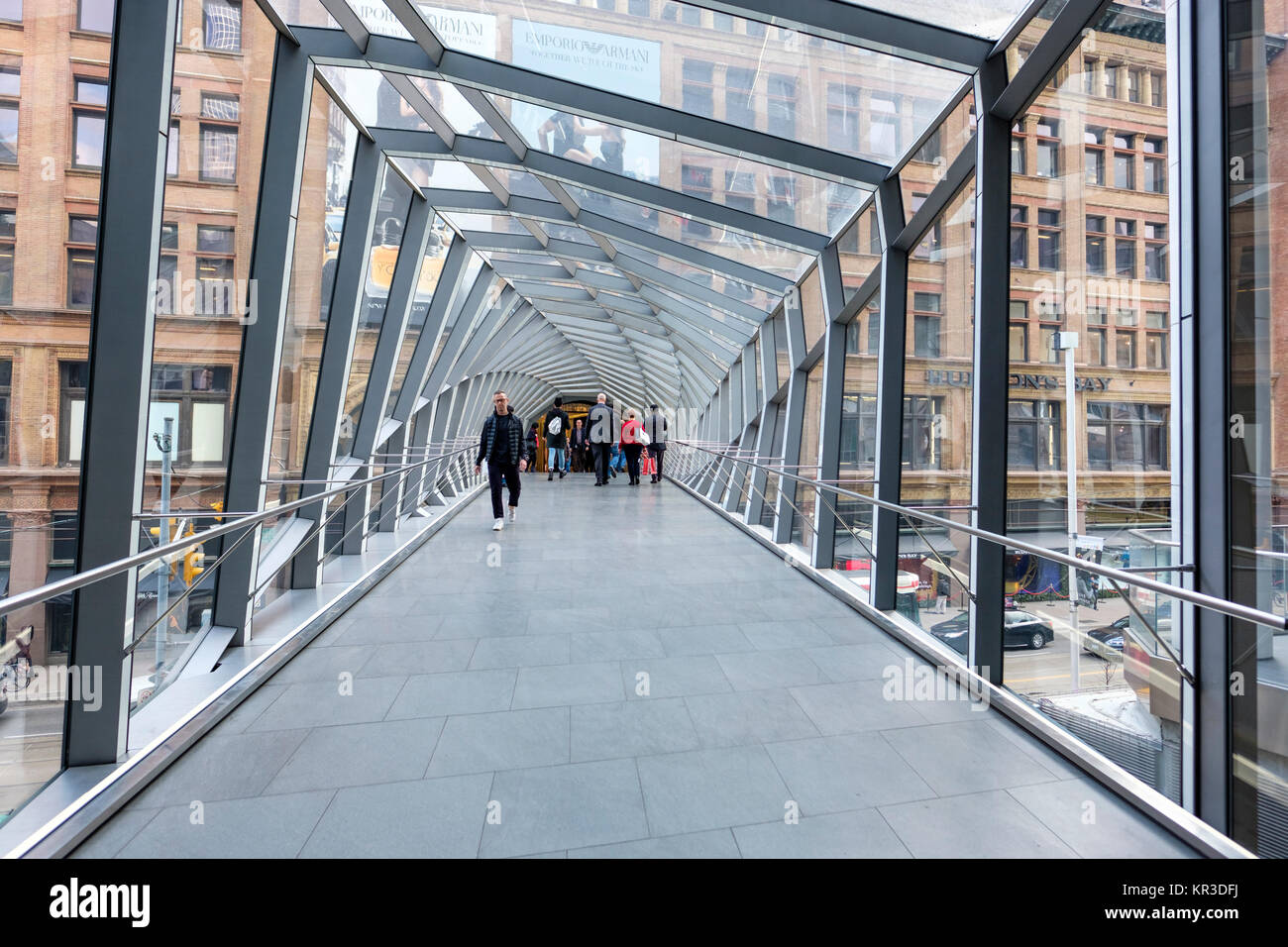 Pedway, elevated pedestrian walkway linking Toronto Eaton Centre shopping center and Saks Fifth Avenue Toronto store, Queen Street West, Canada. Stock Photo