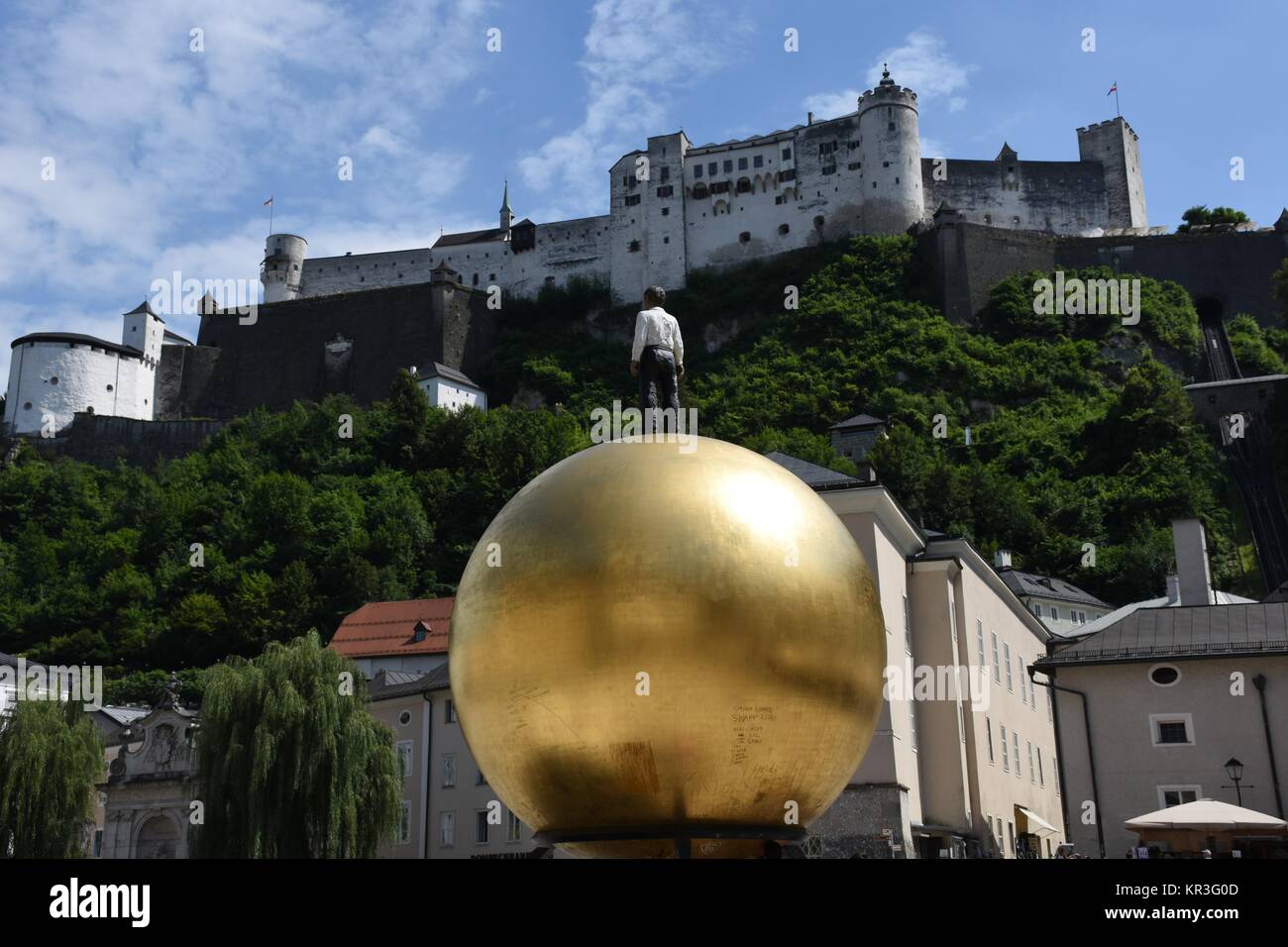 Â salzburg,salzburg cathedral,j kapitelplatz,sphaera,man on ball,gold ball,gold,ball Stock Photo