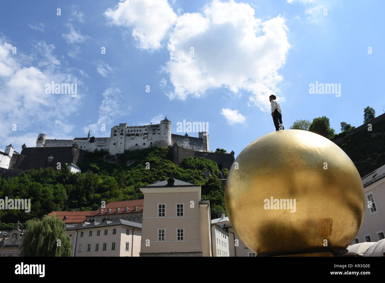 Â salzburg,salzburg cathedral,j kapitelplatz,sphaera,man on ball,gold ball,gold,ball Stock Photo