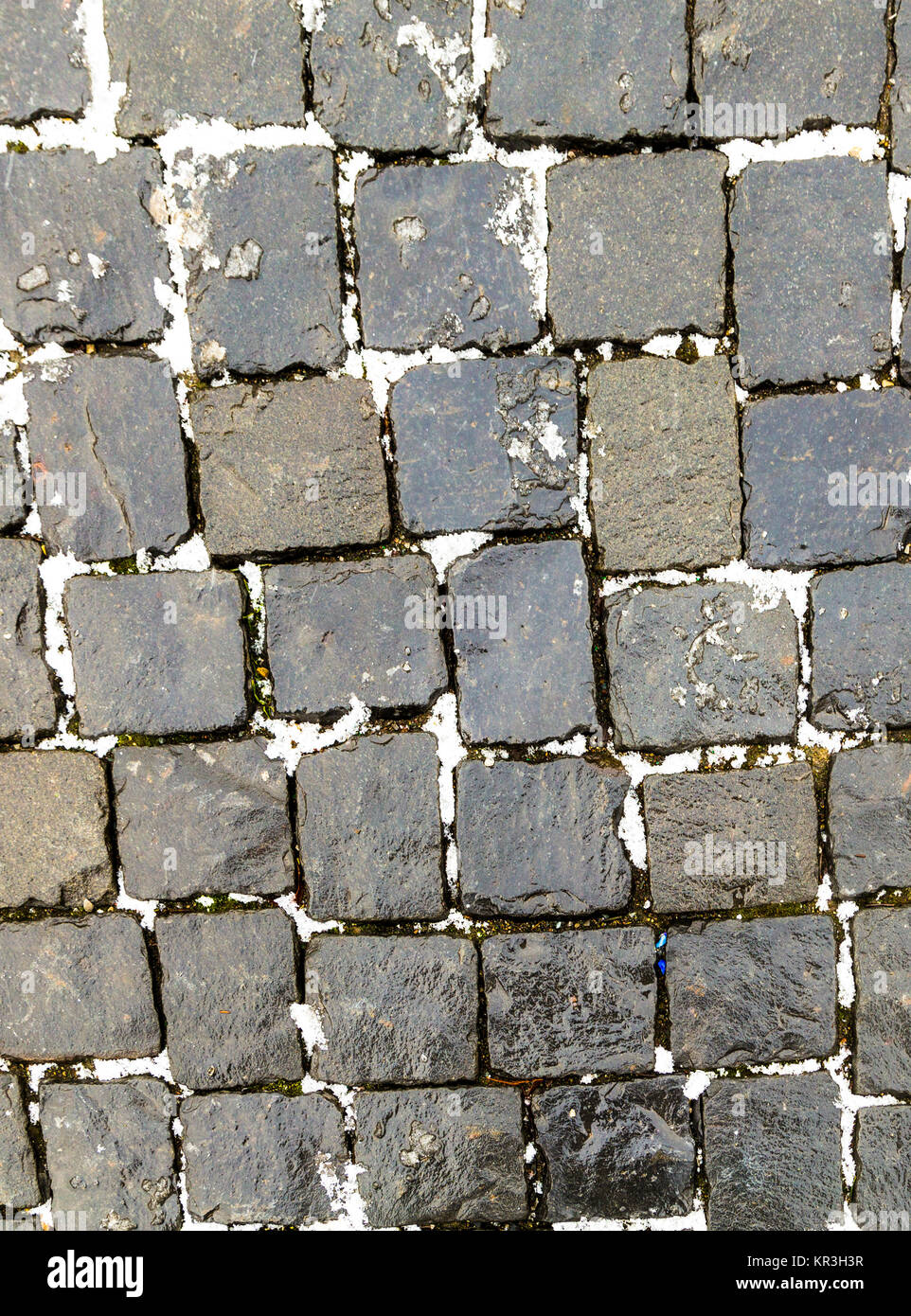 Old Cobble Stone Street Background with snow Stock Photo - Alamy