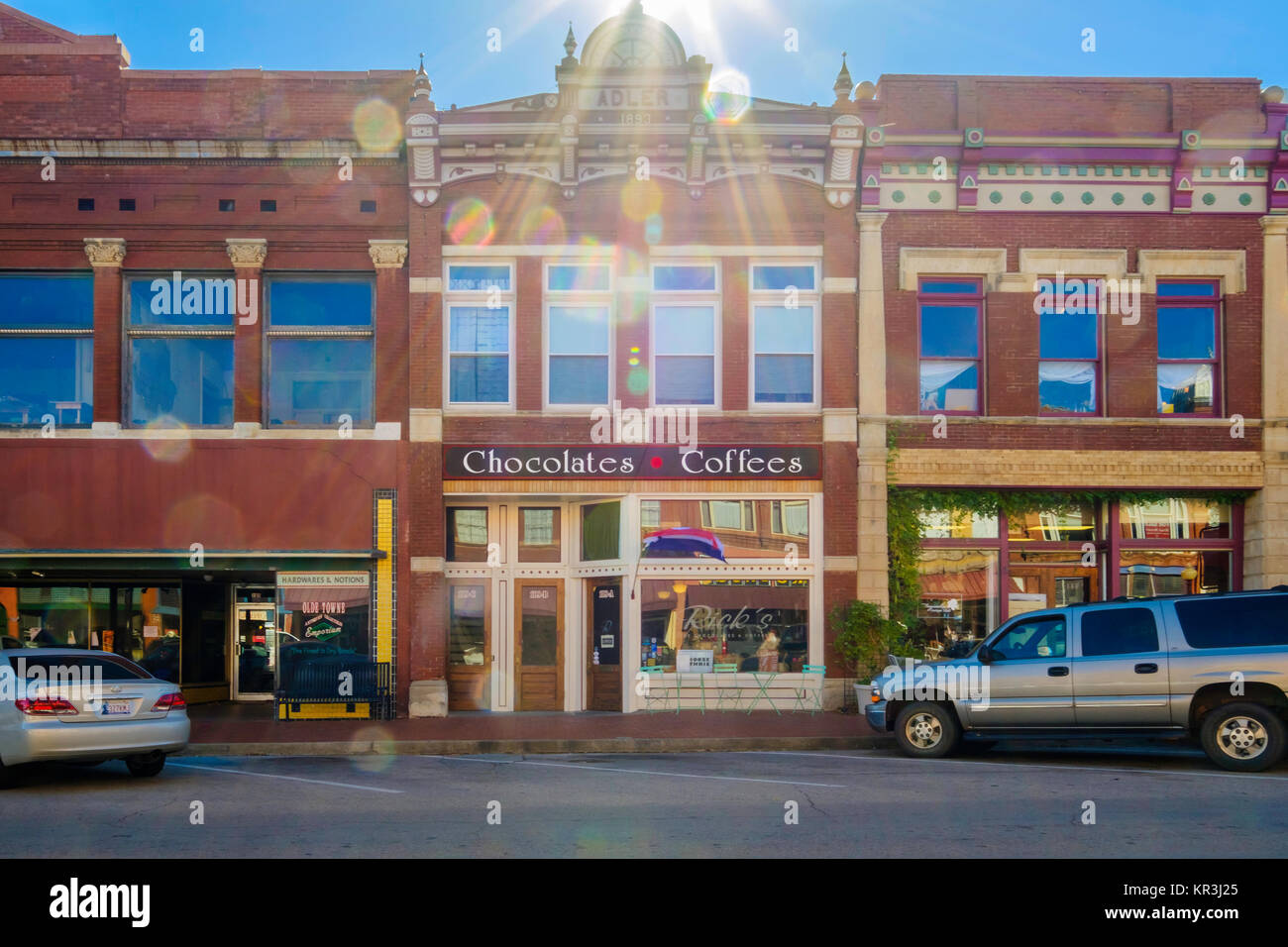 Dave's Chocolates & Coffees, a shop in the historic district of Guthrie, Oklahoma, USA. Sun flare. Stock Photo