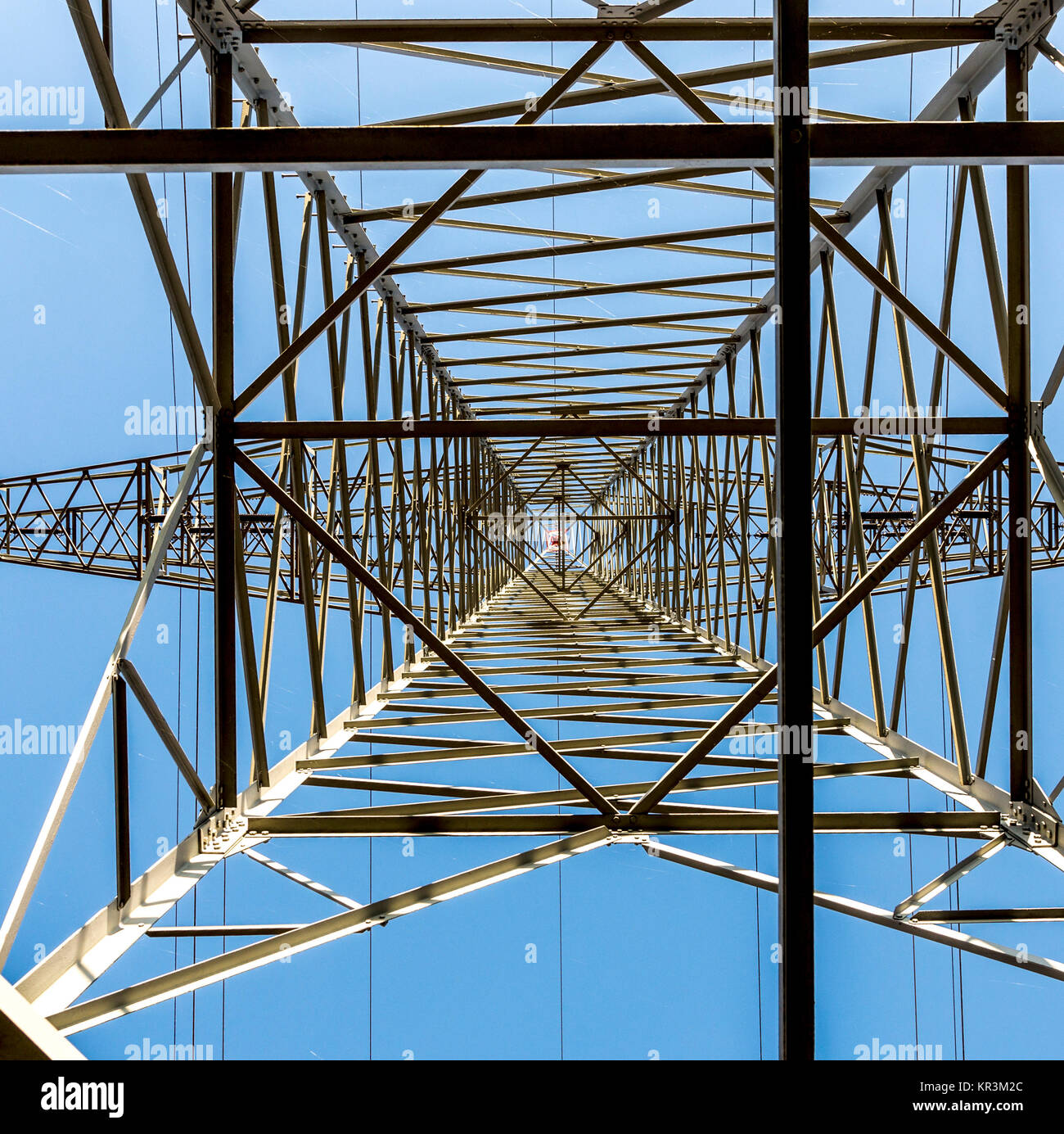 A high voltage electricity pylons against blue sky and cloud Stock ...