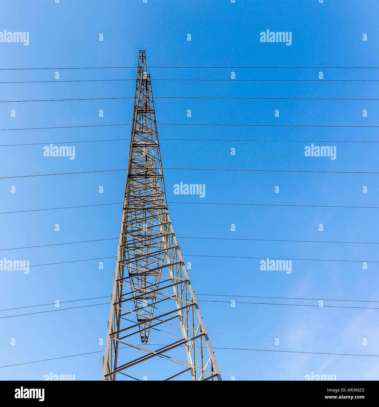 A high voltage electricity pylons against blue sky and cloud Stock ...