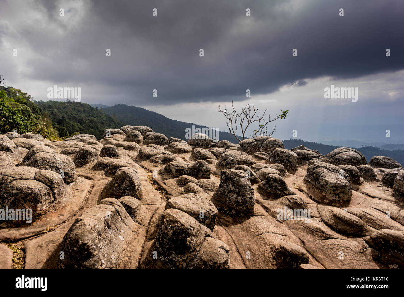 dark and ominous clouds sweeping across the plains seen from the top of a mountain in Phu Ruea national park, Thailand Stock Photo