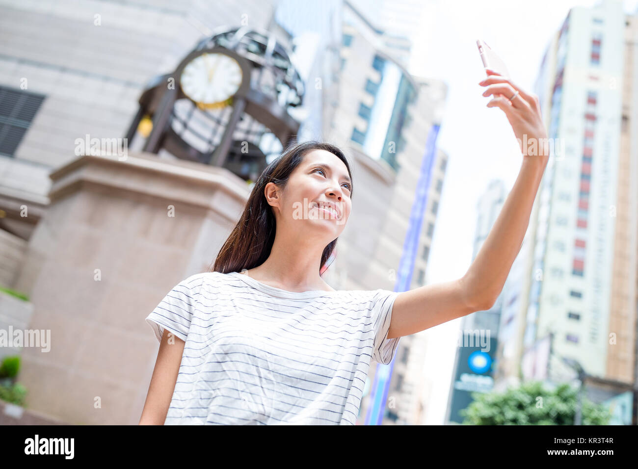 Woman taking selfie in causeway bay of Hong Kong city Stock Photo - Alamy
