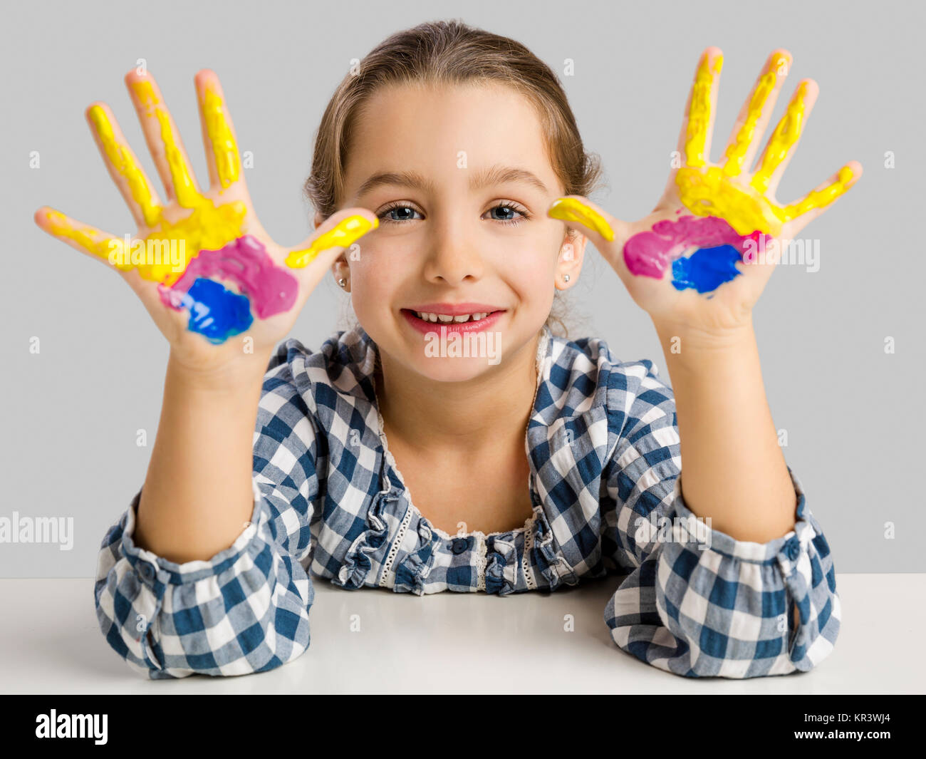 Little girl with hands in paint Stock Photo Alamy