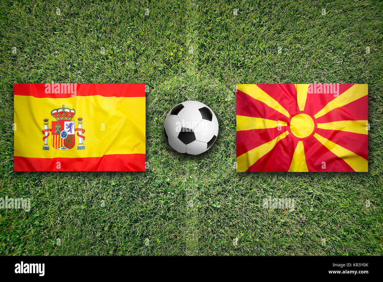 Spain vs. Macedonia flags on soccer field Stock Photo Alamy
