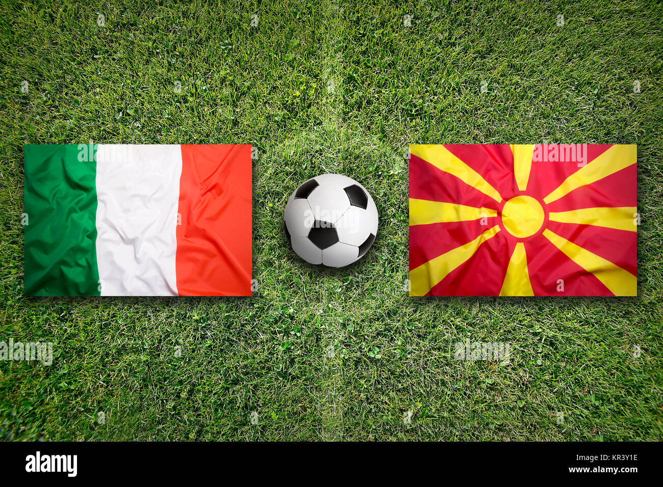 Italy vs. Macedonia flags on soccer field Stock Photo Alamy