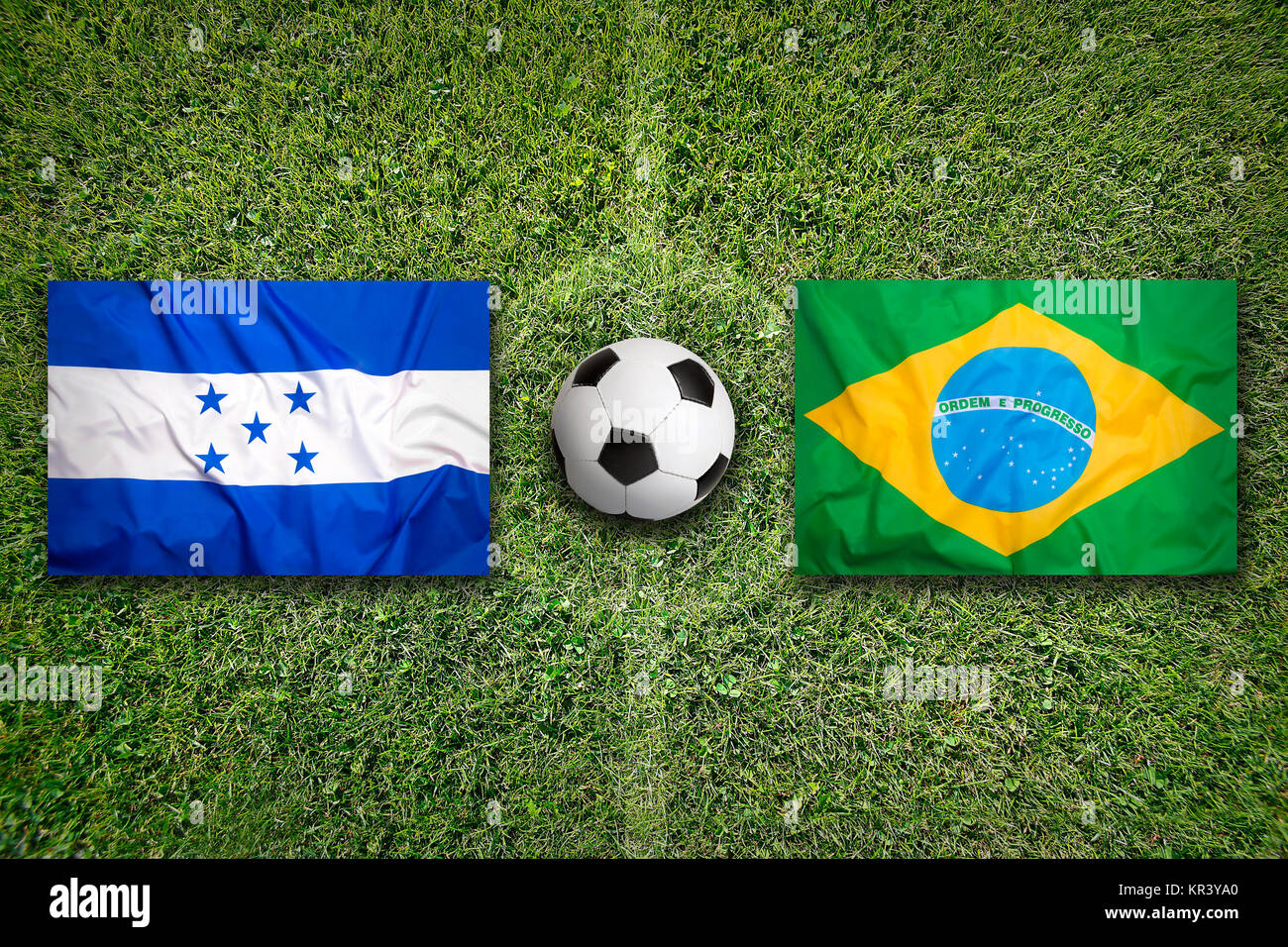 Honduras vs. Brazil flags on green soccer field Stock Photo Alamy