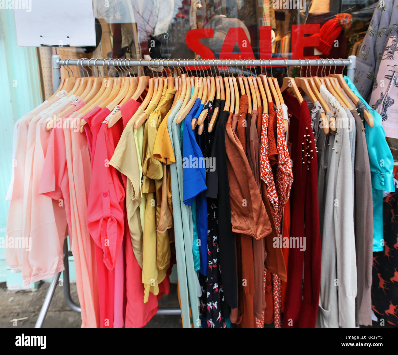 Rack colorful clothes outside store 