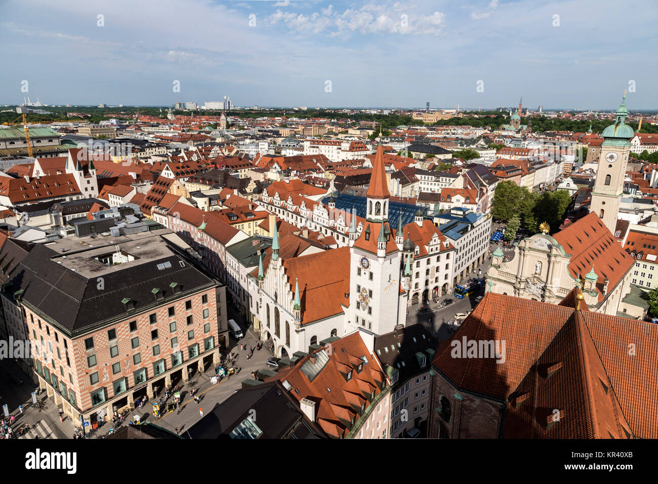 Beautiful super wide-angle sunny aerial view of Munich, Bayern, Bavaria, Germany with skyline and scenery beyond the city, seen from the observation deck of St. Peter Church Stock Photo