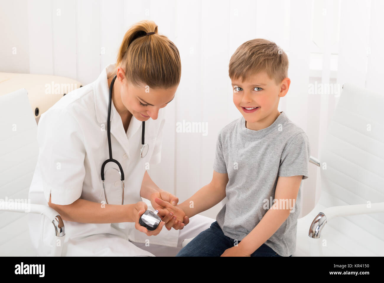 Doctor Examining Blood Sugar Of Little Boy Stock Photo Alamy