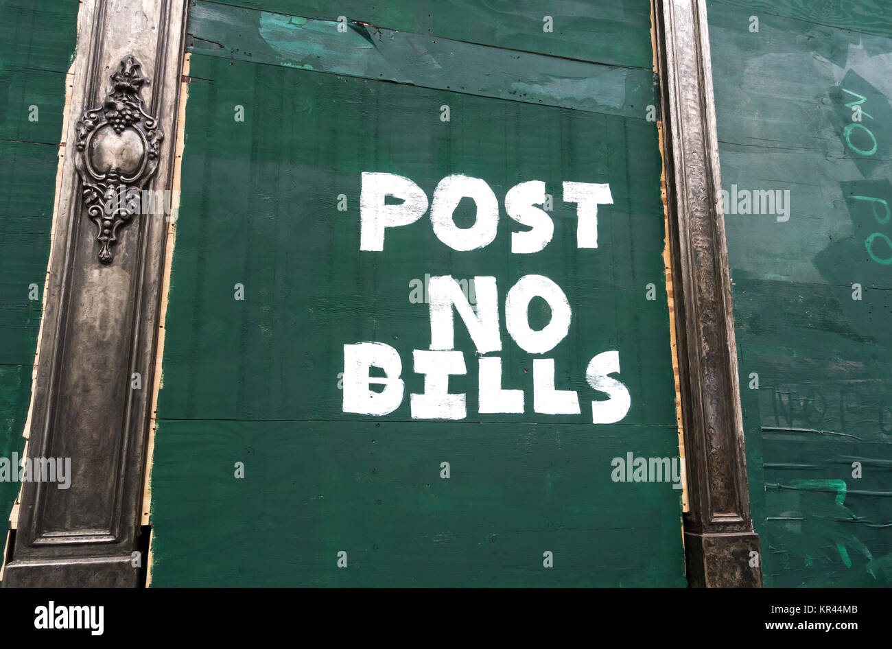Post no bills sign painted on a closed shop in New York City Stock Photo
