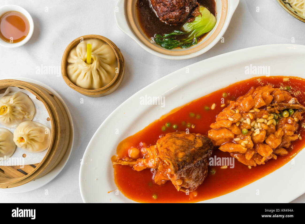 Traditional Shanghai food including dumplings, stewed meatball and mandarin fish Stock Photo