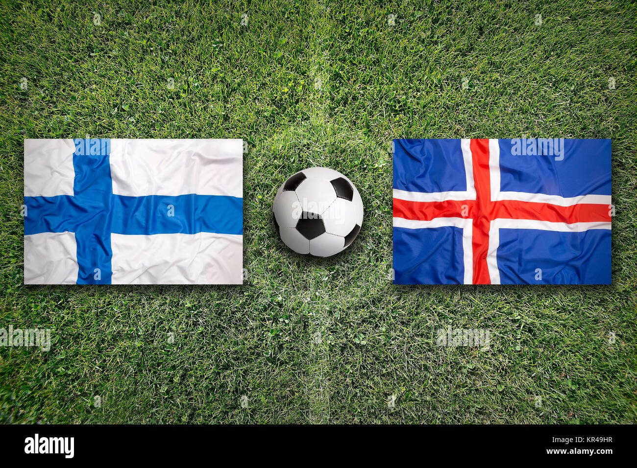 Finland vs. Iceland flags on soccer field Stock Photo Alamy