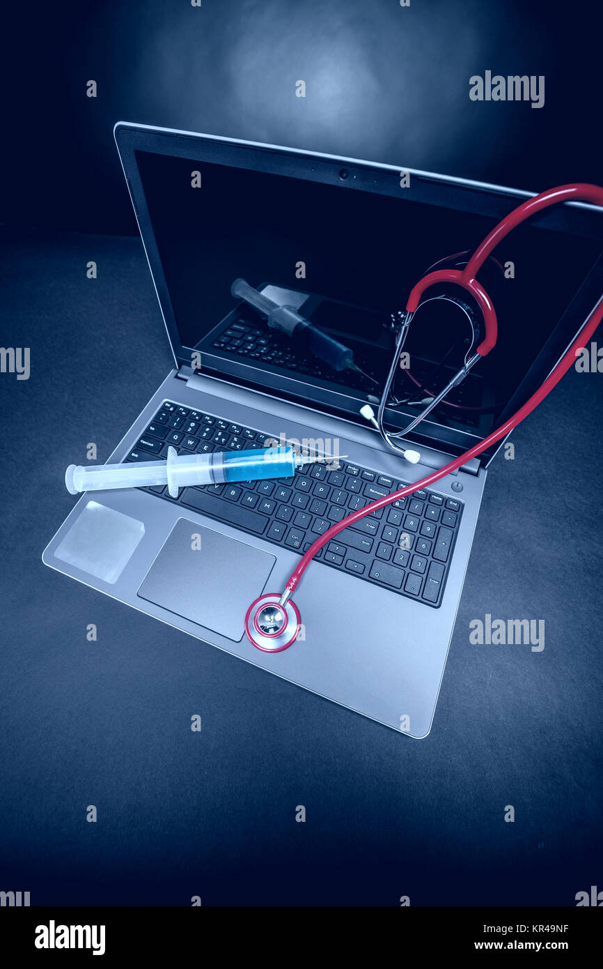 Laptop with a stethoscope Stock Photo - Alamy