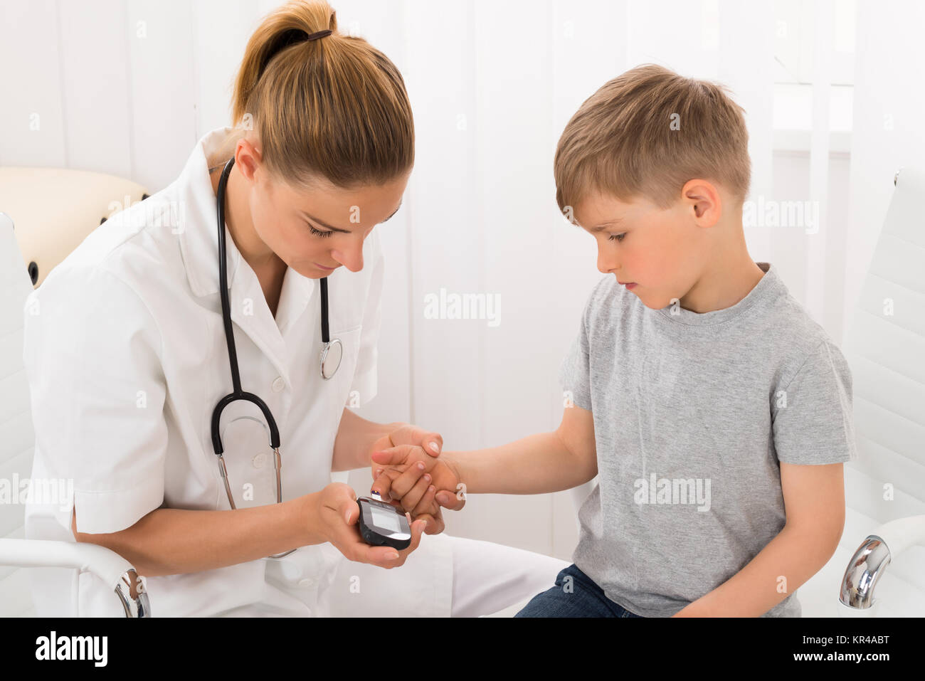 Doctor Examining Blood Sugar Of Little Boy Stock Photo Alamy
