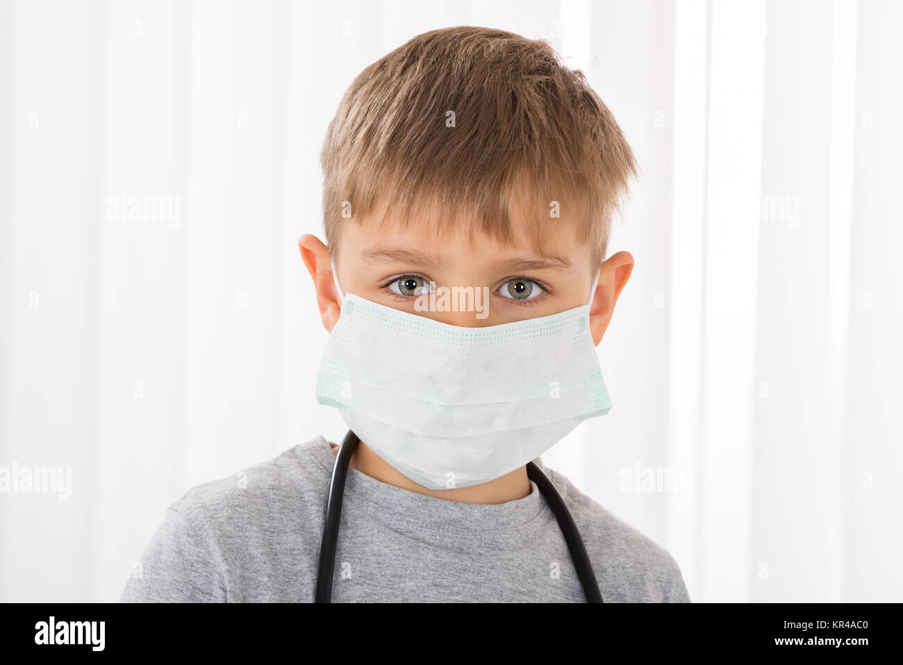 Boy Doctor With Surgical Mask Stock Photo - Alamy
