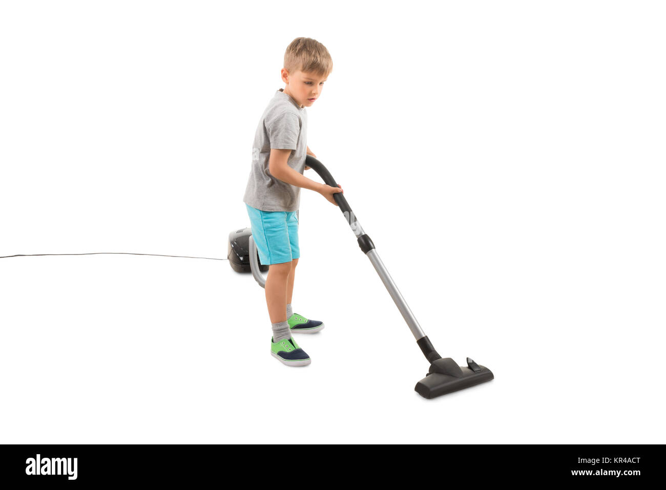 Boy Using Vacuum Cleaner Stock Photo Alamy